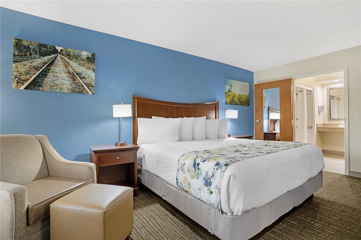 King room at Best Western Monroe — TV, work desk, and sliding door